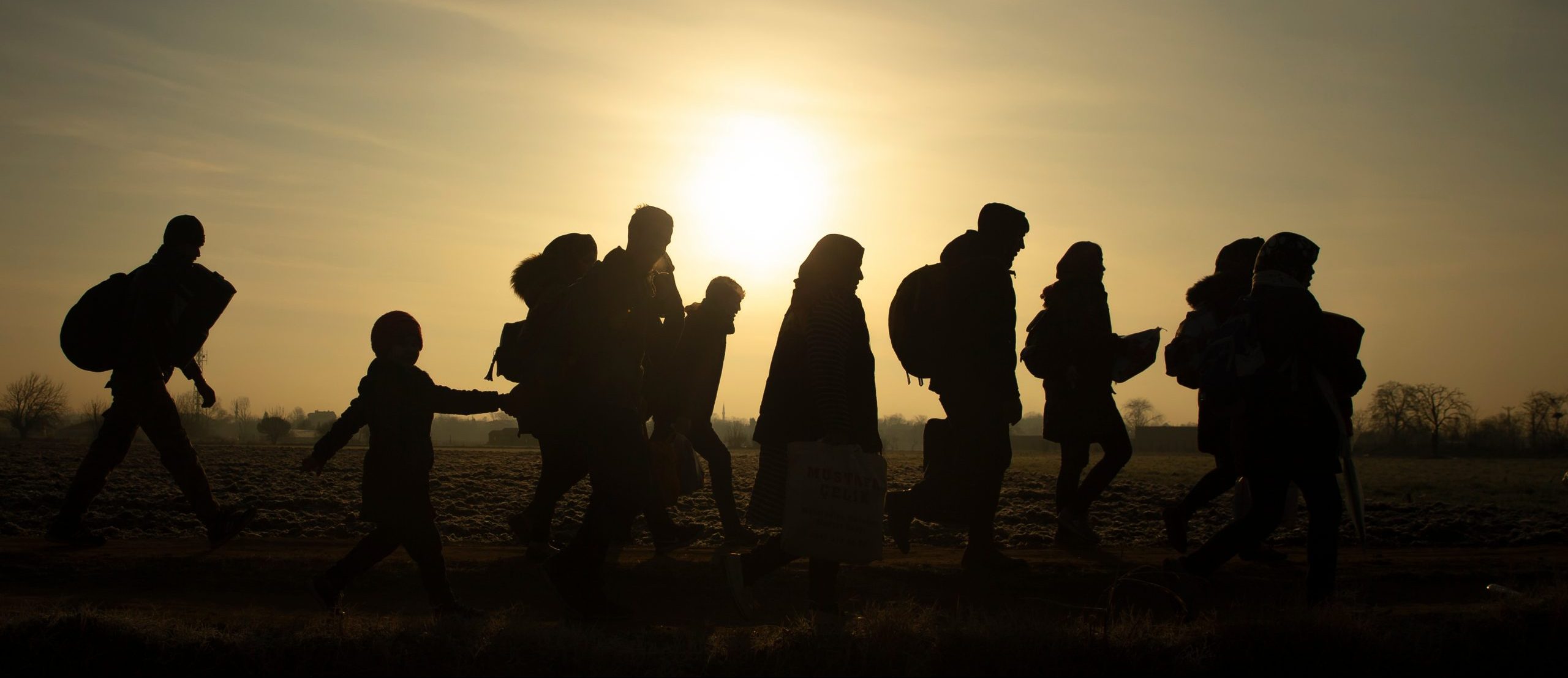 Migrants,Walk,Towards,The,Turkey's,Pazarkule,Border,Crossing,With,Greece's